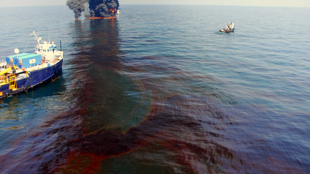 The Premiere Explorer of Venice, La. stands by near a controlled burn of spilled oil from in the Deepwater Horizon/BP oil spill in the Gulf of Mexico June 9, 2010. (Photo by Deepwater Horizon Response)