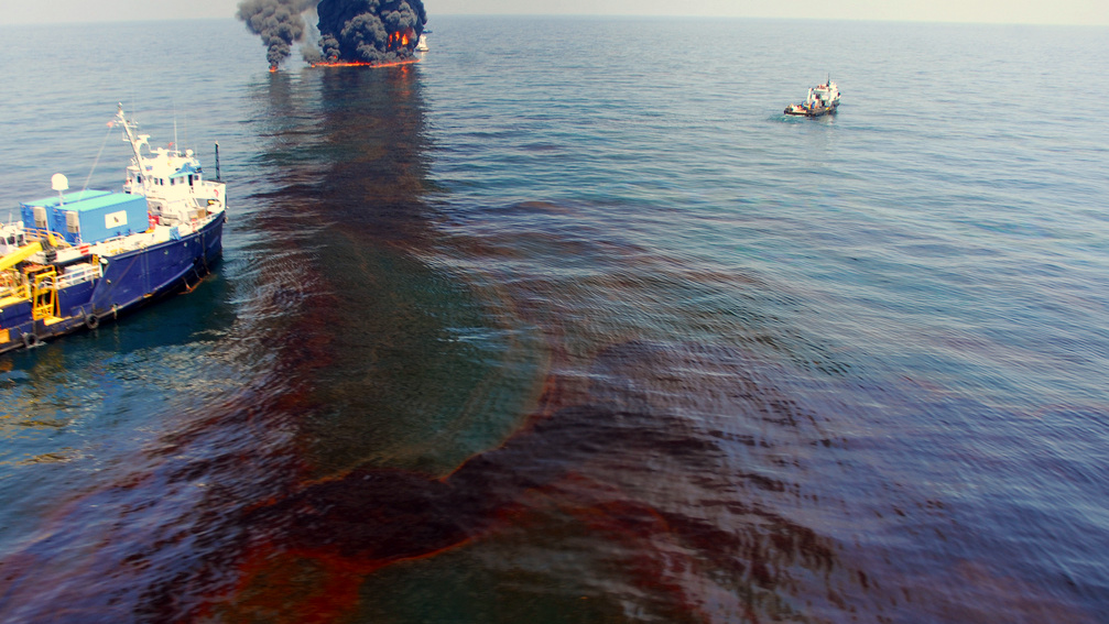 The Premiere Explorer of Venice, La. stands by near a controlled burn of spilled oil from in the Deepwater Horizon/BP oil spill in the Gulf of Mexico June 9, 2010. (Photo by Deepwater Horizon Response)