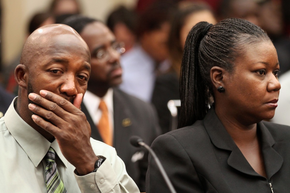 Trayvon Martin's parents, father, Tracy Martin, left, and mother Sybrina Fulton attend a House Judiciary Committee briefing on racial profiling and hate crimes, Tuesday, March 27, 2012, on Capitol Hill in Washington. (AP Photo/Jacquelyn Martin)