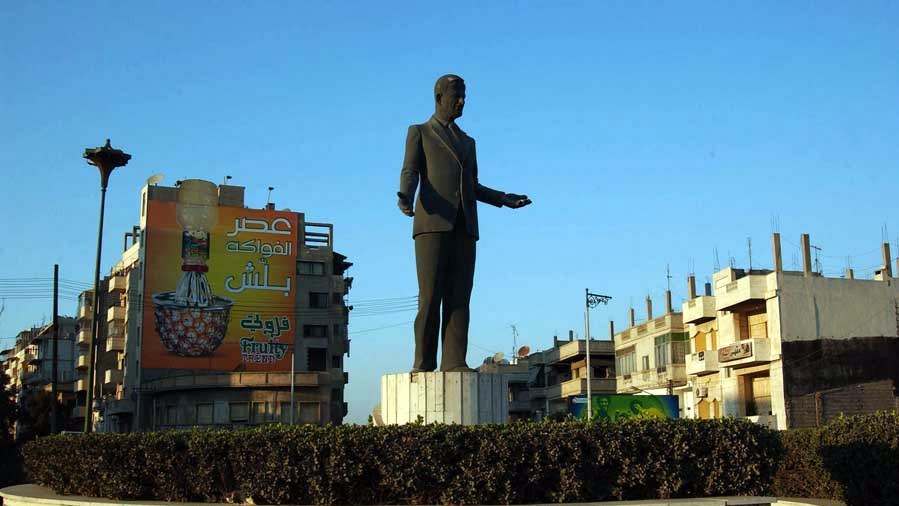 A statue of Hafiz Al-Assad stand guard over a public square in Homs, Syria (Photo by MintPress).