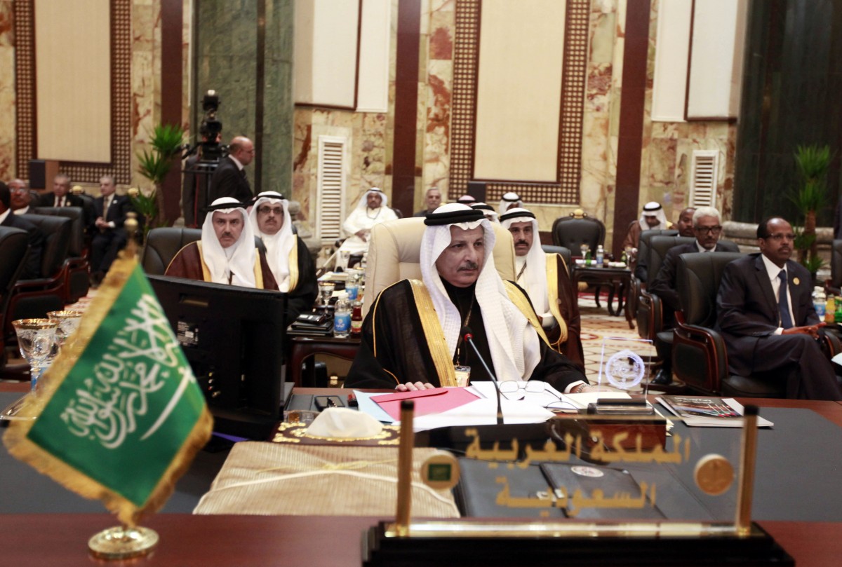 Saudi Arabia's permanent representative to the League of Arab States Ahmad al-Qattan, center, attends the Arab League summit in Baghdad, Iraq, Thursday, March, 29, 2012. The annual Arab summit meeting opened in the Iraqi capital Baghdad on Thursday with only 10 of the leaders of the 22-member Arab League in attendance and amid a growing rift between Arab countries over how far they should go to end the one-year conflict in Syria. (AP Photo/Karim Kadim)