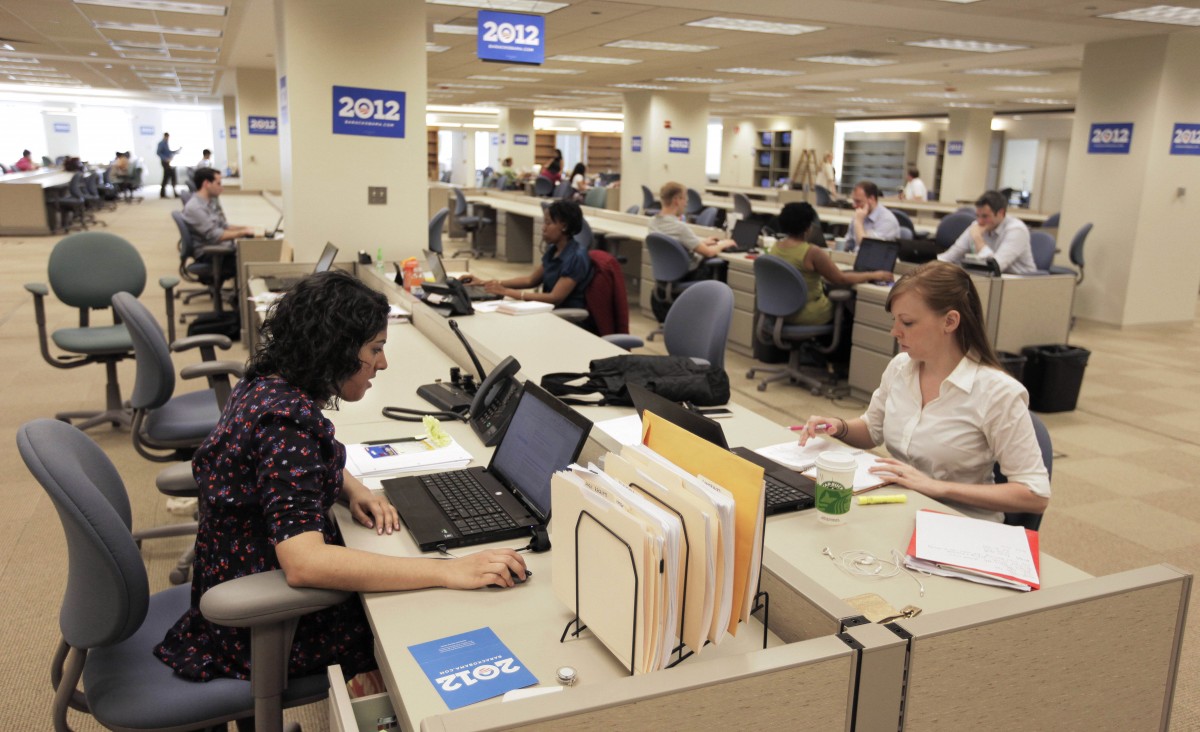 FILE - In this May 12, 2011, file photo, staff members work at President Barack Obama's 2012 re-election campaign headquarters during a media tour of the new facility in Chicago. With Republicans locked in a contentious and expensive primary, Obama has spent a small fortune to build and maintain a campaign operation thats larger, more diverse and more focused on the general election than any of his opponents organizations. Republican contenders like Mitt Romney have been closely watching their expenses during the primary campaign. But Obama faces no serious challenger for the Democratic nomination. He has sunk much of his cash into an expansive brick-and-mortar operation with offices in nearly every state. (AP Photo/M. Spencer Green, File)