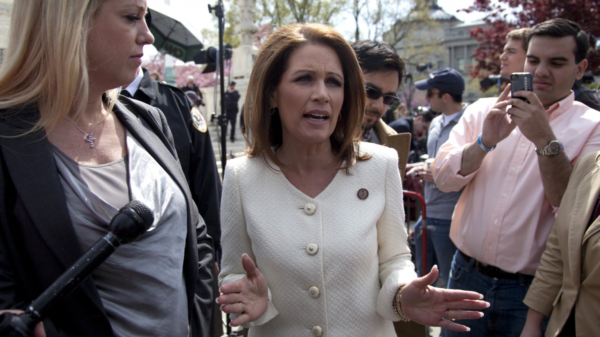 Rep. Michele Bachmann, R-Minn., right, accompanied by Florida Attorney General Pam Bondi, speaks in front of the Supreme Court in Washington, Wednesday, March 28, 2012, as the court concluded three days of hearing arguments on the constitutionality of President Barack Obama's health care overhaul. (AP Photo/Carolyn Kaster)
