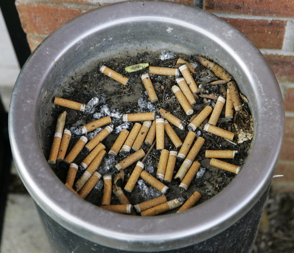 An ashtray full of cigarette butts is shown in Omaha, Neb., in this March 28, 2007 file photo. (AP Photo/Nati Harnik, File)