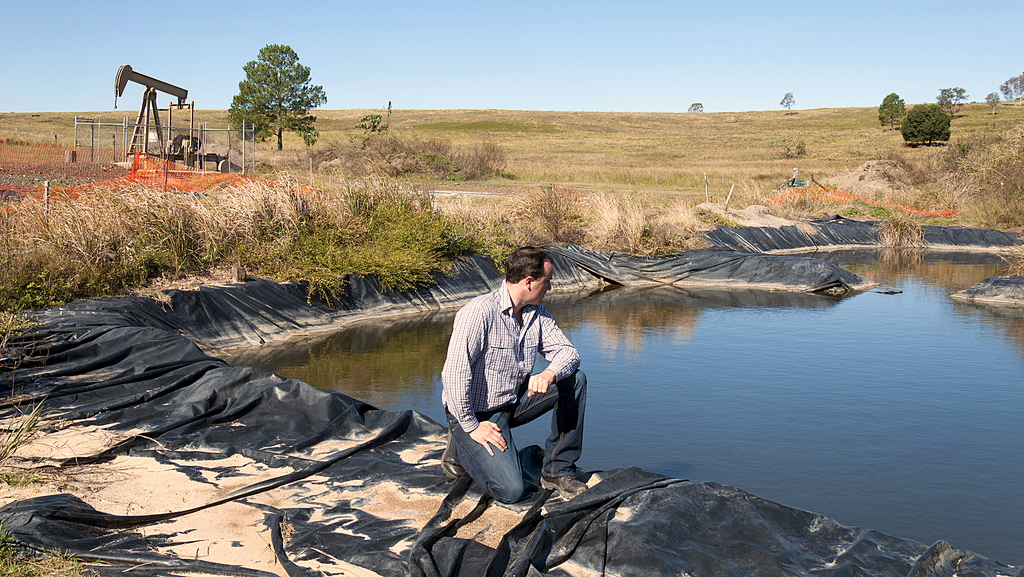 A man inspects a fracking pond in Yorklea, New South Wales, AU on May 13, 2011. a (Photo by Jeremy Buckingham)