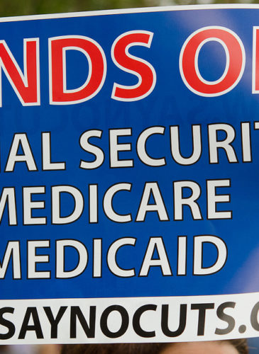 Sign at Occupy St Pete: "Hands Off Social Security, Medicaid Medicare" "www.SayNoCuts.org" (Photo by Robert Neff)