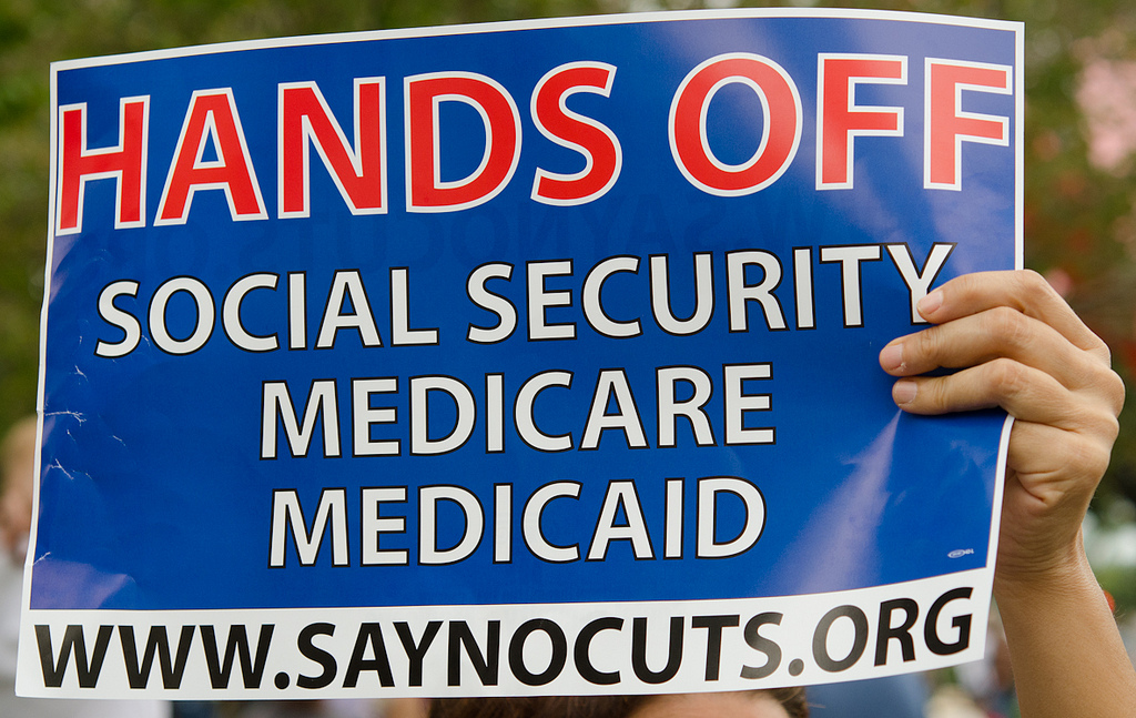 Sign at Occupy St Pete: "Hands Off Social Security, Medicaid Medicare" "www.SayNoCuts.org" (Photo by Robert Neff)
