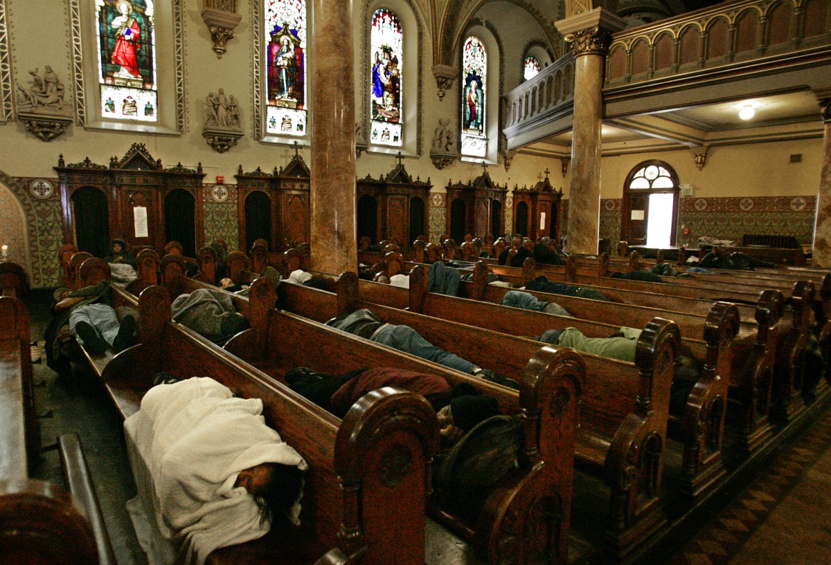 Homeless people sleep on pews at St. Boniface Church in San Francisco on Wednesday, Sept. 14, 2005. (AP Photo/Ben Margot)