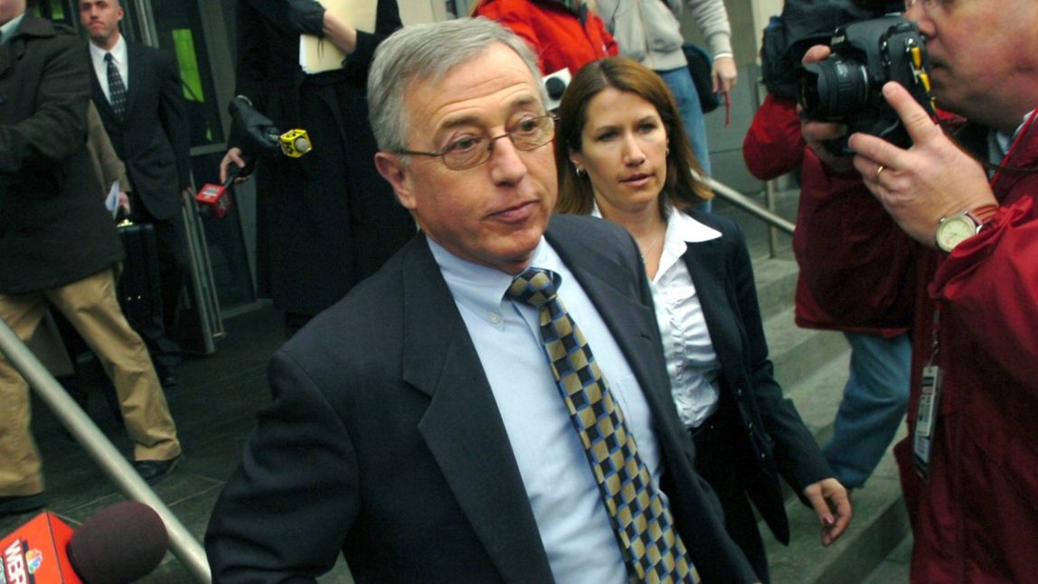 Mark Ciavarella, center, leaves the federal courthouse in Scranton, Pa., in this Feb. 12, 2009 file photo. The Pennsylvania Supreme Court has overturned hundreds of juvenile convictions issued by Ciavarella.