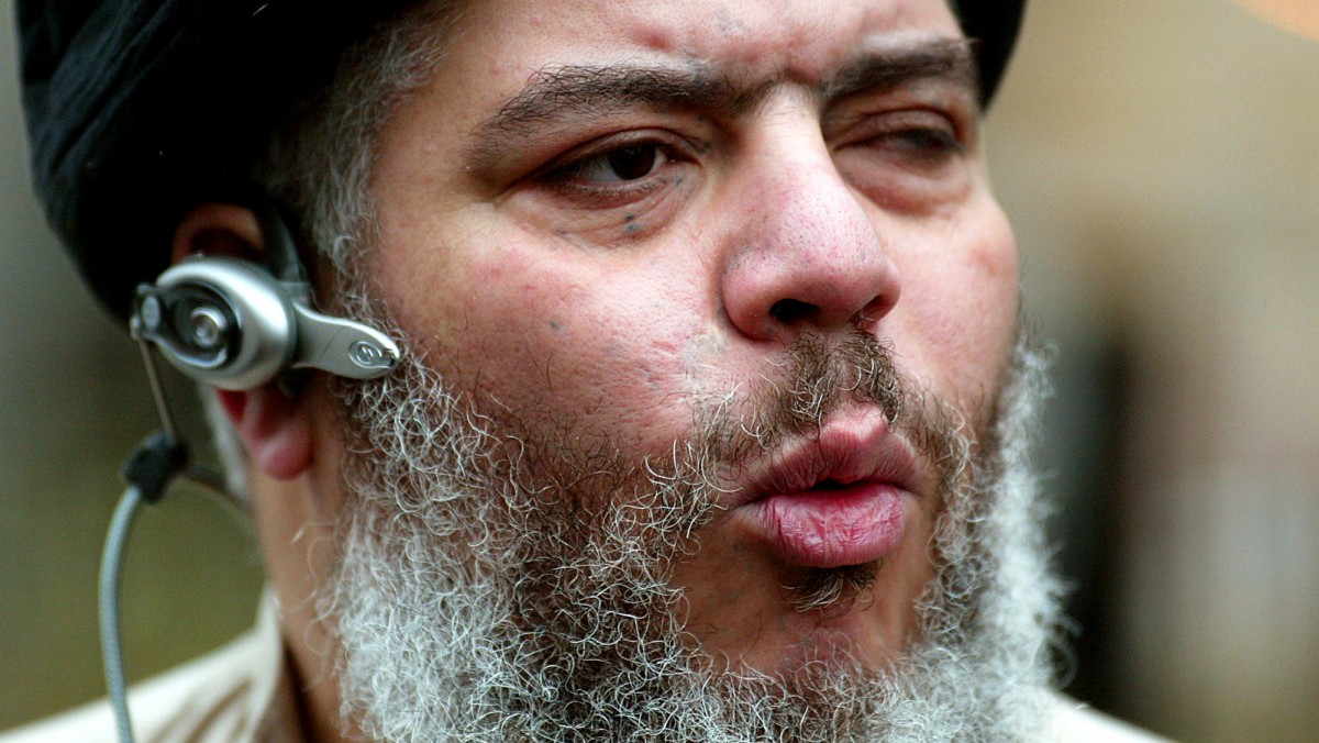 A closeup of cleric Abu Hamza, wearing a bluetooth headset, as he speaks in London.
