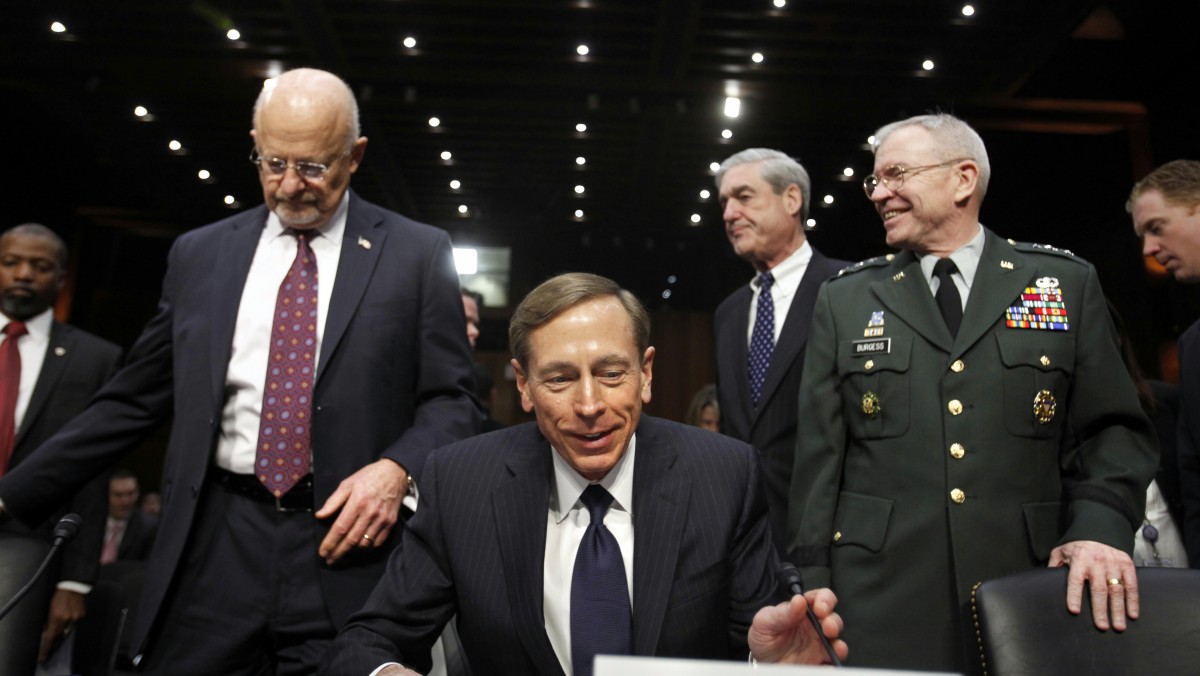 From left, Director of National Intelligence James Clapper, CIA Director David Petraeus, FBI Director Robert Mueller, and Defense Intelligence Agency Director Lt. Gen. Ronald Burgess take their seats on Capitol Hill in Washington, Tuesday, Jan. 31, 2012, prior to testifying before the Senate Intelligence Committee hearing to assess current and future national security threats. (AP Photo/Jacquelyn Martin)