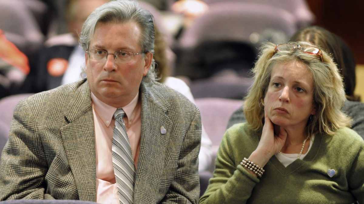 FILE - In this March 7, 2011, file photo, Dr. William Petit Jr., left, whose wife and two daughters were killed in a 2007 home invasion in Cheshire, Conn., and his sister Johanna Petit Chapman, right, listen to speakers at a committee hearing on legislation to repeal the death penalty at the Legislative Office Building in Hartford, Conn. Dr. Petit successfully lobbied lawmakers to hold off on legislation for repeal while one of the two men accused in the death of Petit's family was still facing a death penalty trial. The legislature gave final approval to a repeal bill Wednesday night, April 11, 2012. Democrat Gov. Dannel P. Malloy said he will sign the bill into law. (AP Photo/Jessica Hill, File)