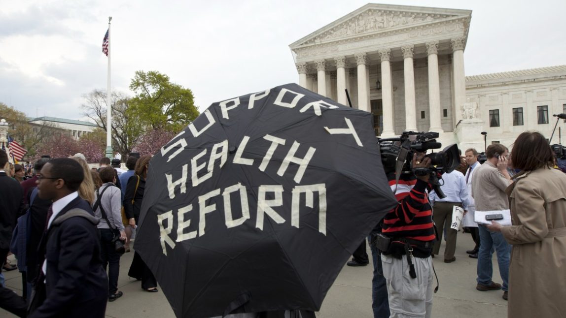 Protesters continue their stance at the steps of the U.S. Supreme Court in Washington, D.C., March 28, 2012. (Mannie Garcia/MintPress)