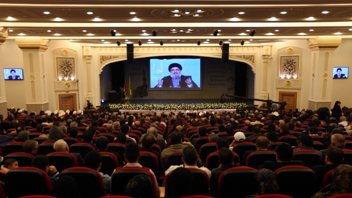 Hezbollah leader Sheik Hassan Nasrallah speaks via a TV screen from a secret location, during the inauguration of the Sayda Zeinab complex in the southern suburb of Beirut, Lebanon, Friday, March 30, 2012. Nasrallah said that the only solution in Syria is a political one. He urged countries to help Syria by working on closing the gaps between the government and the opposition and convincing parties to enter into a serious and honest dialogue. (AP Photo/Bilal Hussein)