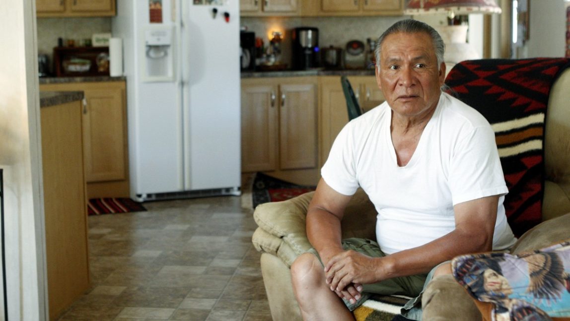 Charles Tiger is pictured during an interview in his FEMA trailer home in Little Axe, Okla., Thursday, June 16, 2011. Nearly six years after the hurricane, the mobile homes that became a symbol of the government's failed response are finally being put to good use. FEMA has quietly given many of them away to American Indian tribes that are in desperate need of affordable housing. (AP Photo/Sue Ogrocki)