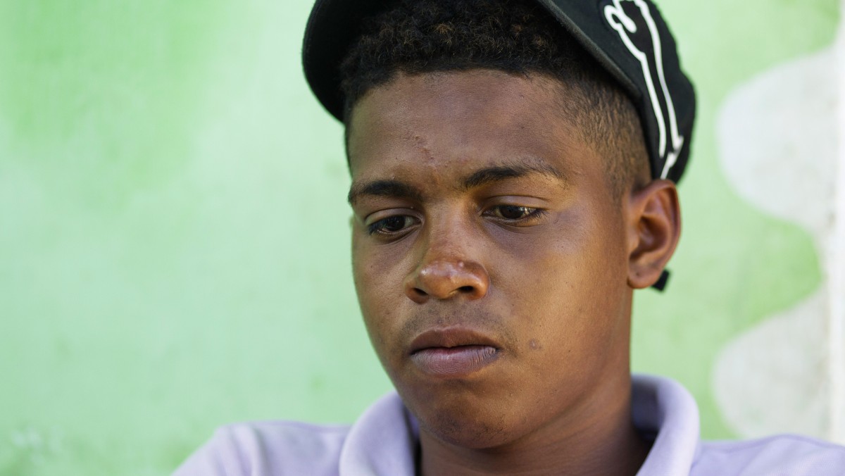 Adrian Vasquez pauses during an interview with the Associated Press outside his home in the town of Rio Hato, Panama, Thursday, April 19, 2012. Vasquez, an 18-year-old Panamanian, went on a fishing trip with two friends last Feb. 24 but while returning home, their motor died. They had been drifting for16 days when birdwatchers with powerful spotting scopes on the deck of the luxury cruise ship Star Princess saw their boat adrift miles away and told ship staff about a man desperately waving a red cloth. The cruise ship didn't stop, and the fishing boat drifted another two weeks before it was found. By then, Vasquez's two friends had died. (AP Photo/Tito Herrera)