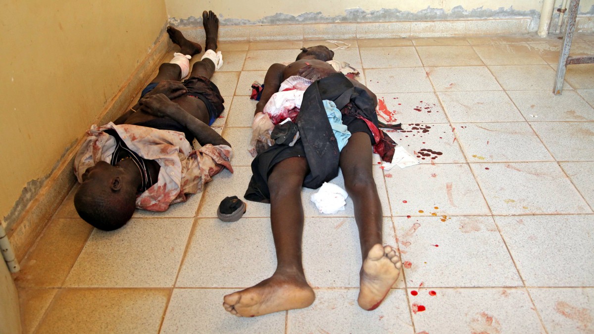 In this photo of Saturday, April 14, 2012, two victims of bombings lie at the Bentiu Hospital in an unknown condition. Two Sudanese Sukhoi jet fighters dropped 6 bombs in the Bentiu area of Sudan killing five and wounding four others, Saturday, April 14, 2012. Sudan and the newly formed South Sudan continued to battle Monday April 16 2012 over a disputed oil rich border area. (AP Photo/Michael Onyiego)