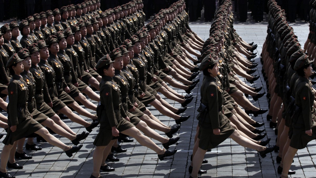 In an April 15, 2012 photo, North Korean soldiers attend a mass military parade in Pyongyang's Kim Il Sung Square to celebrate 100 years since the birth of the North Korean founder Kim Il Sung. Spectacles in North Korea exist at the intersection of dogma, tedium and entertainment. (AP Photo/Vincent Yu)