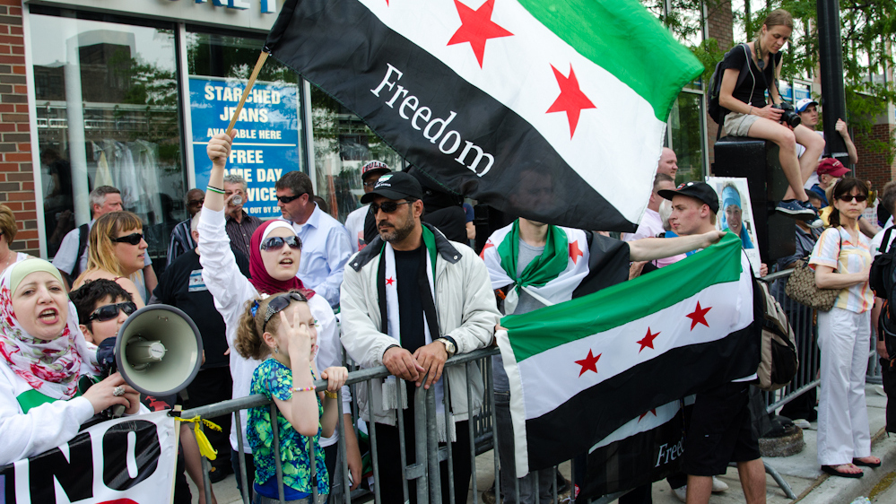 A small group of Syrian protesters called for a NATO-imposed no fly zone over Syria on May 20. Occupy Wall Street and numerous anti-war groups from around America and other countries are taking place in the protest march. (Photo Norbert Schiller/Mint Press)