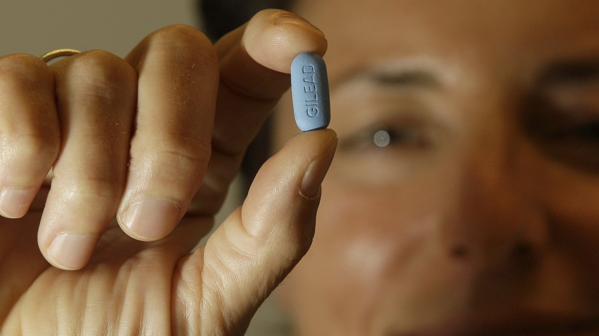 In this Thursday, May 10, 2012 photo, Dr. Lisa Sterman holds up a Truvada pill at her office in San Francisco. (AP Photo/Jeff Chiu)