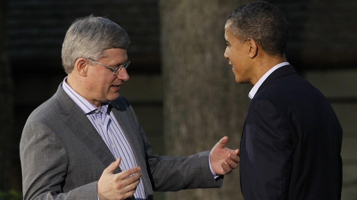 President Barack Obama greets Canada's Prime Minister Stephen Harper on arrival for the G8 Summit Friday, May 18, 2012 at Camp David, Md. (AP Photo/Charles Dharapak)