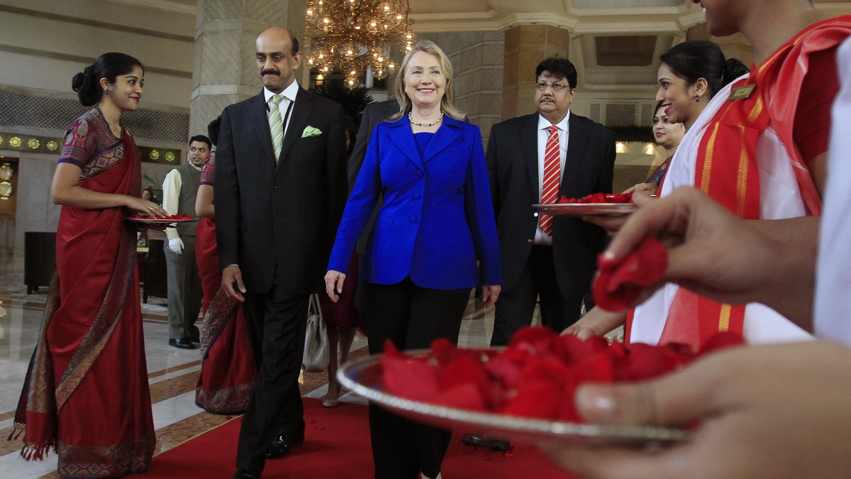 U.S. Secretary of State Hillary Rodham Clinton leaves the Taj Hotel in Kolkata Monday, May 7, 2012. Clinton urged energy-starved India on Monday to reduce its Iranian oil imports to keep up pressure on the Islamic republic to come clean about its nuclear program. (AP Photo/Shannon Stapleton, Pool)