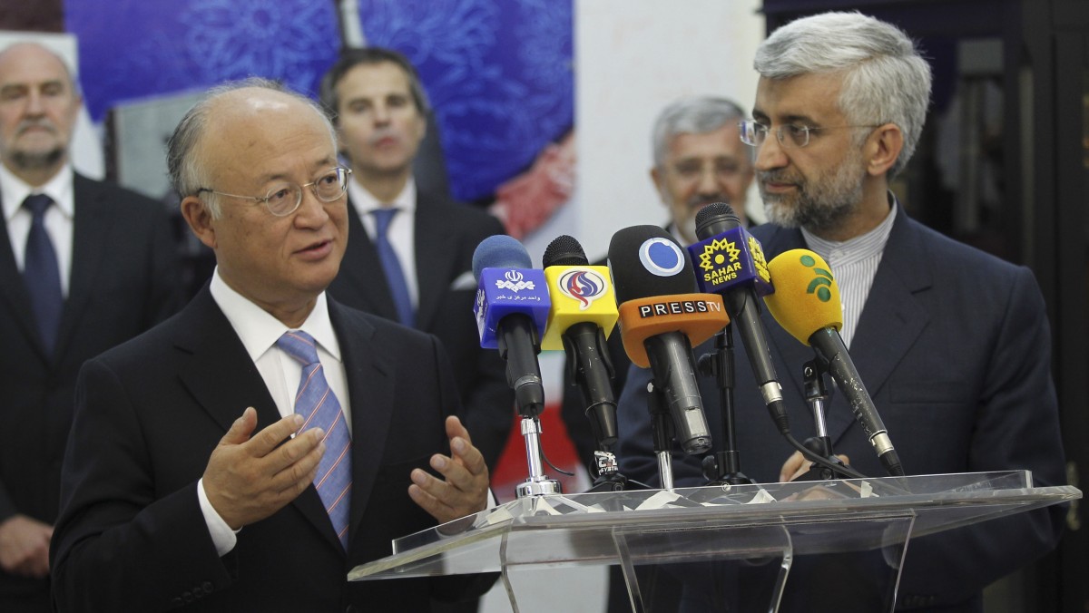 International Atomic Energy Agency (IAEA) chief Yukiya Amano, left, talks with reporters during a news briefing at the conclusion of his meeting with Iran's top nuclear negotiator, Saeed Jalili, right, in Tehran, Iran, Monday, 21, 2012. The head of the U.N. nuclear agency arrived Monday in Tehran on a key mission that could lead to the resumption of probes by the watchdog on whether Iran has secretly worked on an atomic weapon. It would also strength the Islamic Republic's negotiating hand in crucial nuclear talks with six world powers later this week in Baghdad. (AP Photo/IRNA,Adel Pazzyar)
