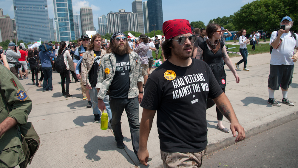 Veterans protested war by marching to McCormik Place, the venue for the NATO meetings, and throwing their medals toward the building in a gesture of opposition to U.S. military action. (Photo Norbert Schiller/Mint Press)