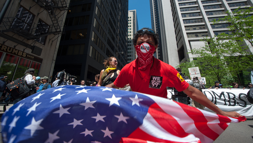 Occupy activists took to the streets the last day of the NATO summit Monday, May 21, 2012 during a peace protest against Boeing, a company supplying aircraft and missiles to the United States. (Photo by Norbert Schiller/Mint Press)