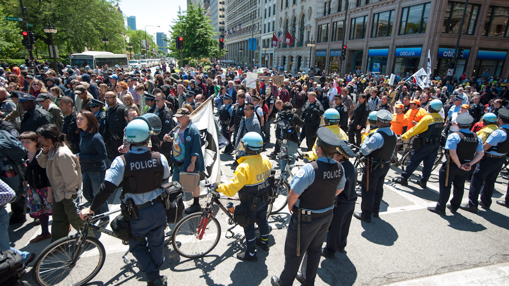 Demonstrators stage a peaceful march through Chicago's financial district protesting the NATO Summit taking place in the city on Monday May 21, 2012. The demonstration was organized by numerous anti-war and capitalist groups including Occupy Wall Street. (Photo Norbert Schiller/Mint Press)