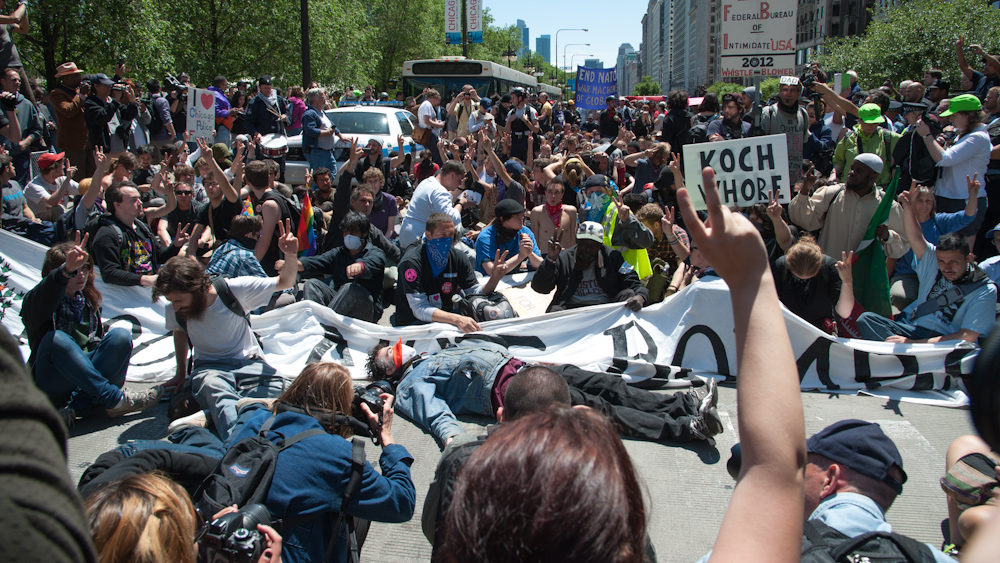 Demonstrators block an intersection during a peaceful protest on the last day of the NATO summit in Chicago Monday, May 21, 2012. (Photo by Norbert Schiller/Mint Press)