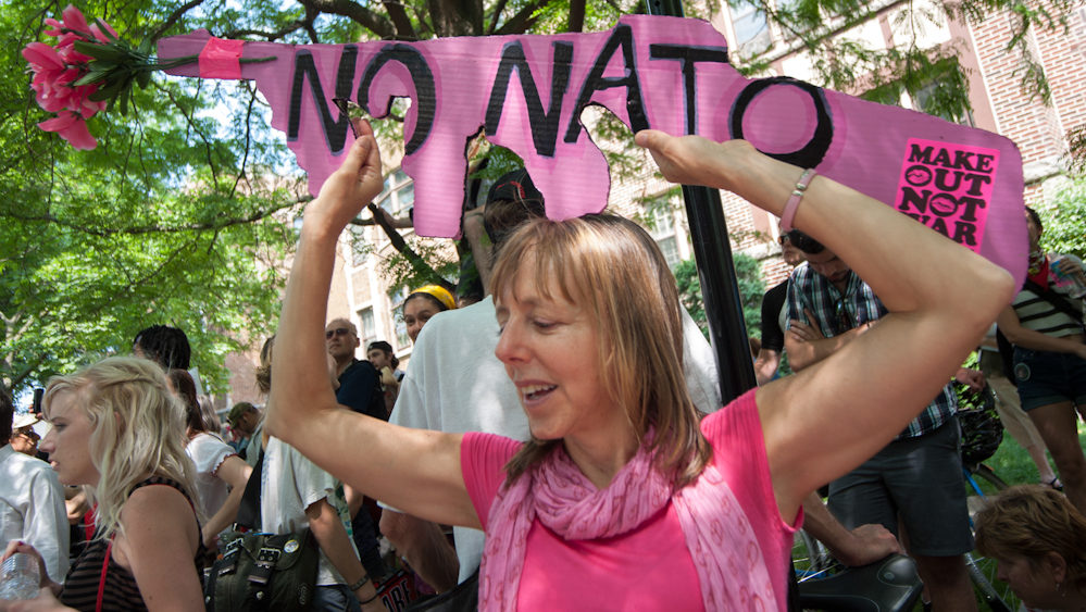 Medea Benjamin, a prominent activist with CodePink, holds a sign protesting NATO. CodePink was a leading force during the demonstrations in Chicago during the NATO summit. (Photo Norbert Schiller/Mint Press)