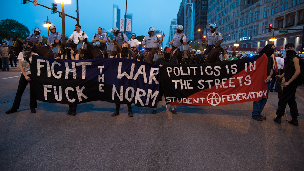 On the eve of the NATO Summit taking place in Chicago thousands of peaceful protesters representing a wide range of interests took to the streets protesting the military alliance on Saturday, May 19, 2012. The crowds ran through the streets in an attempt to avoid massive police blockades while chanting slogans. There were only a few minor scuffles between protesters and the police. (Photo Norbert Schiller/Mint Press)