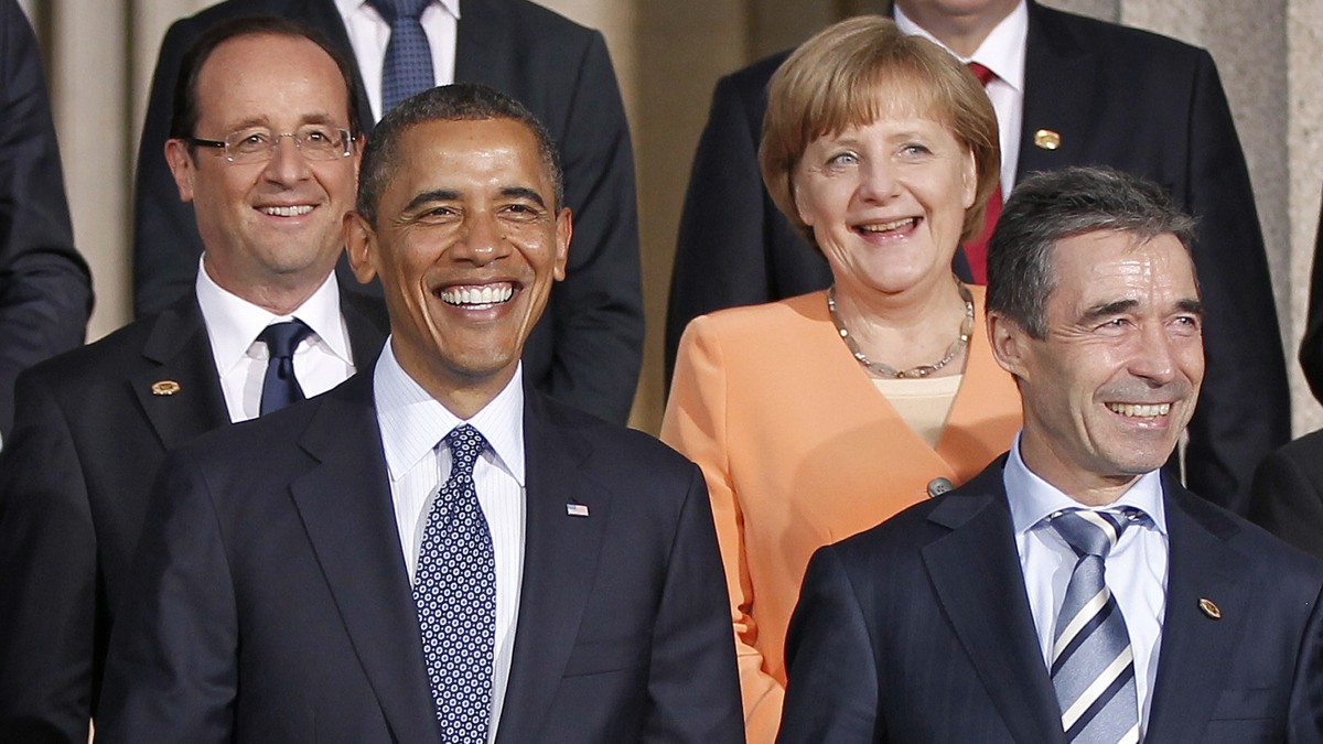 From left to right, French President Francois Hollande, President Barack Obama, German Chancellor Angela Merkel and Secretary General Anders Fogh Rasmussen, during the NATO family photo at Soldier Field at the NATO Summit in Chicago, Sunday, May 20, 2012. (AP Photo/Pablo Martinez Monsivais)