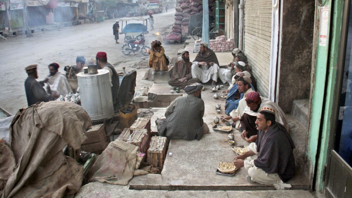 Pakistani daily workers have their breakfast at a roadside food vendor, in the Pakistani border town of Chaman along the Afghanistan border, early Monday, May 14, 2012. (AP Photo/Shah Khalid)