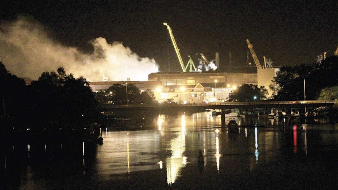 Smoke rises from a dry dock as fire crews respond Wednesday, May 23, 2012 to a fire on the USS Miami SSN 755 submarine at the Portsmouth Naval Shipyard on an island in Kittery, Maine. Four people were injured. (AP Photo/The Herald, Ionna Raptis)