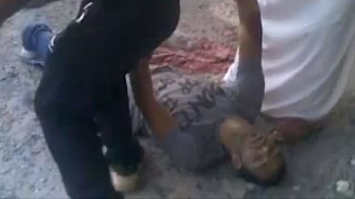 This frame grab made from an amateur video provided by Syrian activists on Monday, May 28, 2012, purports to show the massacre in Houla on May 25 that killed more than 100 people, many of them children. The amateur footage shows people running along a street, purportedly just after the attack on Houla started. (AP Photo/Amateur Video via AP video)