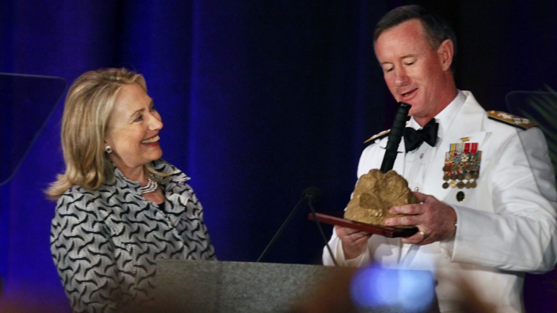 Secretary of State Hillary Rodham Clinton is presented a 'sword in the stone' by Adm. Bill McRaven at the International Special Operations Forces Week conference gala dinner at the Tampa Convention Center on Wednesday, May 23, 2012, in Tampa, Fla. (AP Photo/The Tampa Bay Times, Kathleen Flynn)