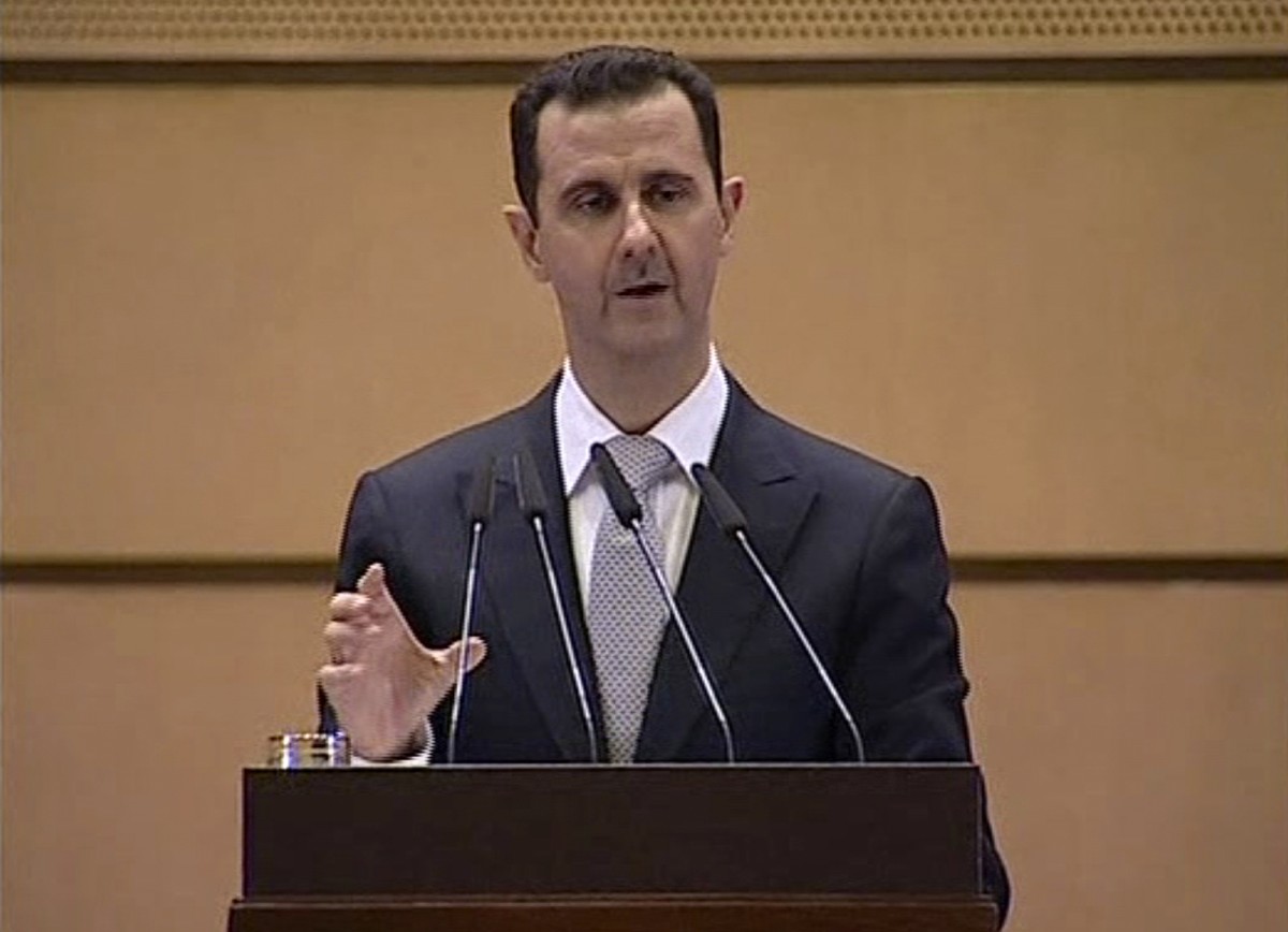 In this image made from video, Syrian President Bashar Assad delivers a speech in Damascus, Syria, Tuesday, Jan. 10, 2012. (AP Photo/Syrian State Television via APTN)