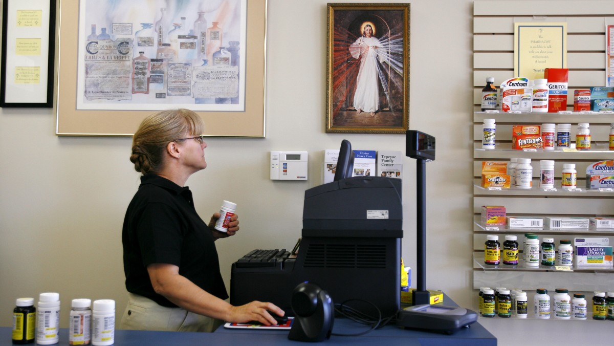 Pam Semler works the register at DMC Pharmacy in Chantilly, Va. on Monday, Oct. 20, 2008. The pharmacy bills itself as "pro-life" and carries no contraceptive products. (AP Photo/Jacquelyn Martin)
