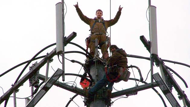 Tower climber Jay Guilford poses atop a cell tower. He was one of 11 climbers to die while working on AT&T jobs during a wave of cell service expansion from 2006 to 2008. Photo courtesy of Bridget Pierce.