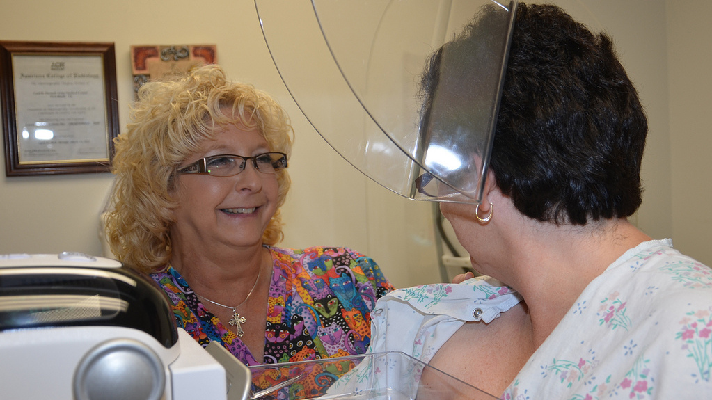 Teresa Ropbitaille, CRDAMC mammography technician, prepares a patient for a mammogram. (Photo by Brandy Gill, CRDAMC PAO)