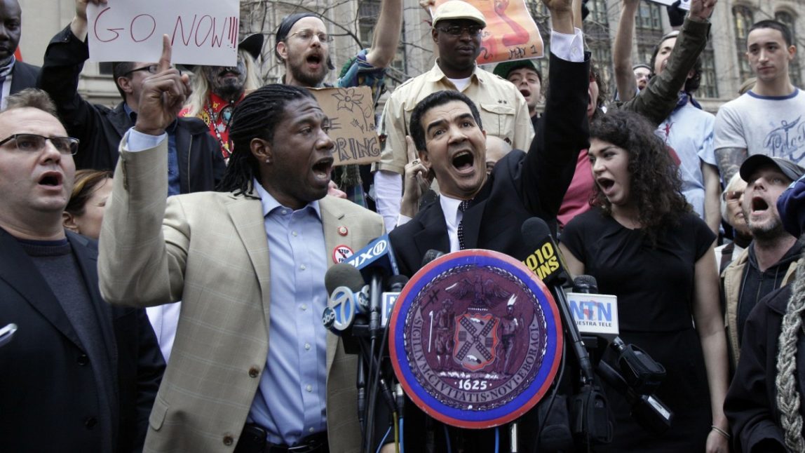 New York City Council members Jumaane Williams, second left, and Ydanis Rodriguez, center, join Occupy Wall Street protesters in New York's Zuccotti Park. (AP Photo/Richard Drew)
