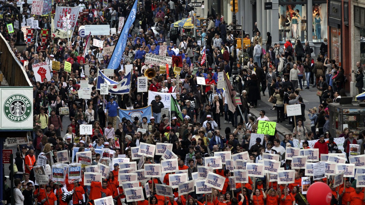 Demonstrators march down Broadway during a May Day rally, Tuesday, May 1, 2012 in New York. Hundreds of activists across the U.S. joined the worldwide May Day protests on Tuesday, with Occupy Wall Street members in several cities leading demonstrations against major financial institutions.(AP Photo/Mary Altaffer)