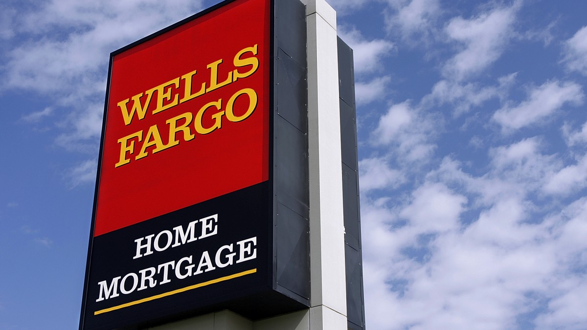 The Wells Fargo logo is displayed outside a home mortgage office in Springfield, Ill., Friday, Oct 3, 2008. (AP Photo/Seth Perlman)