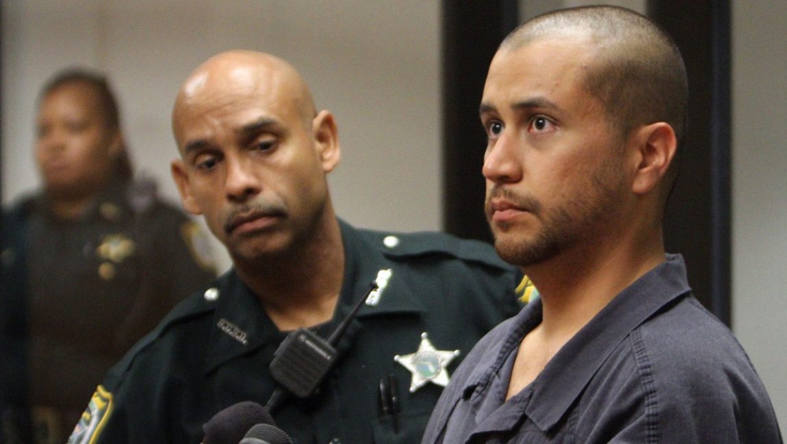 In this Thursday, April 12, 2012 file photo, George Zimmerman, right, stands next to a Seminole County Deputy during a court hearing in Sanford, Fla. (AP Photo/Gary W. Green, Orlando Sentinel, Pool)