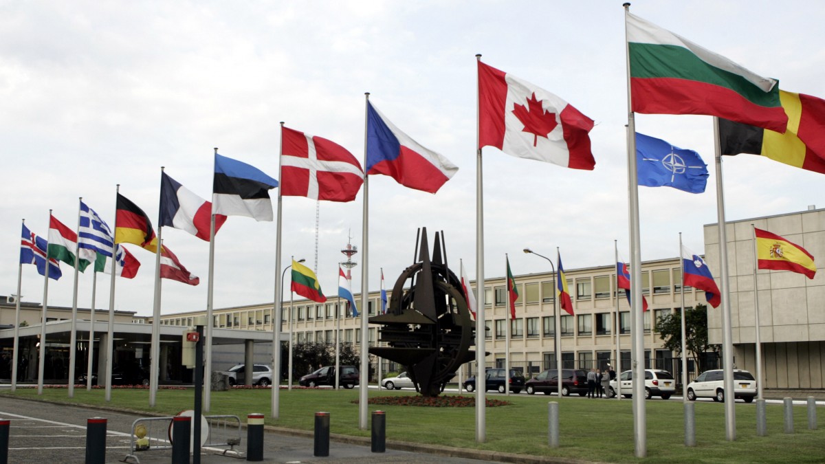 In this Thursday, June 14, 2007 file photo, NATO member country flags are seen outside NATO headquarters in Brussels. (AP Photo/Virginia Mayo File)
