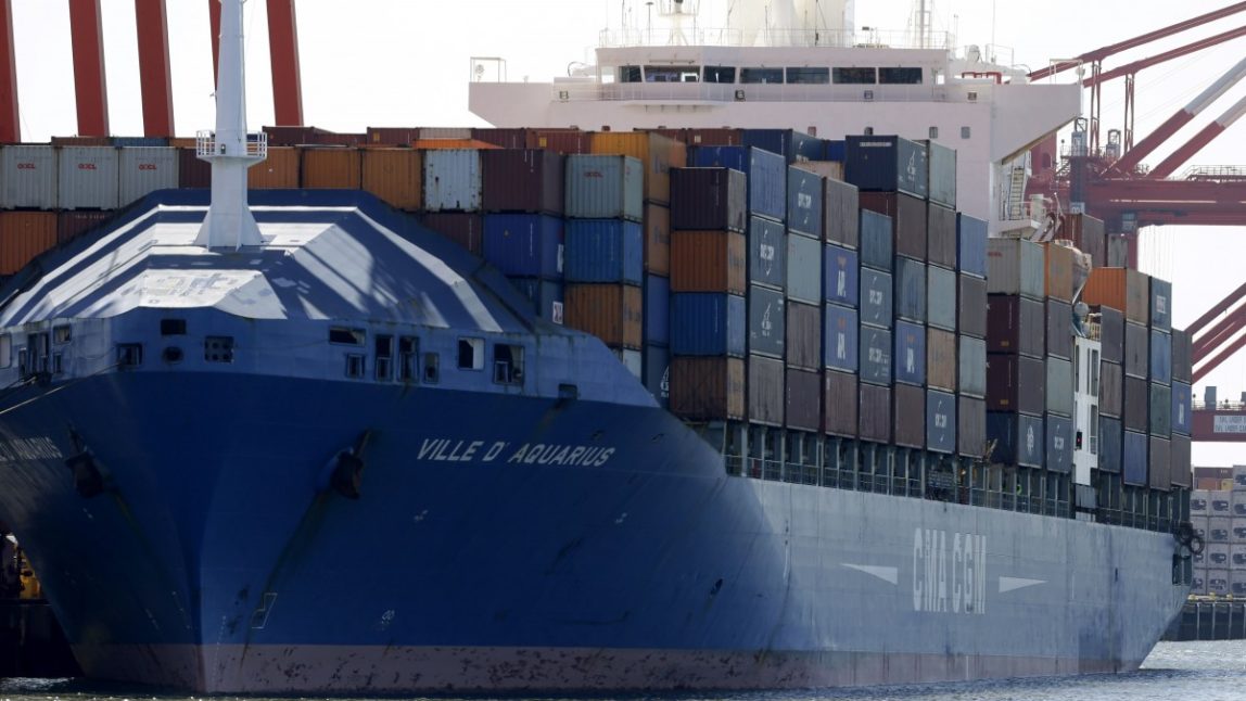 A ship named Ville D' Aquarius is docked at the Port Newark container terminal, Wednesday, June 27, 2012, in Newark, N.J. The Coast Guard suspects there are stowaways in a container that was loaded on a ship. Coast Guard spokesman Charles Rowe says the container was loaded aboard The Villa D'Aquarius in India. The manifest says the container was carrying machine parts to be unloaded in Norfolk, Va. (AP Photo/Julio Cortez)