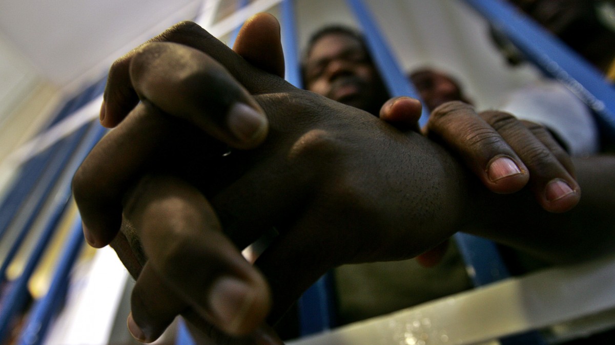 Refugees from the Sudan are seen in a cell at Maasiyahu Prison, in Ramle, Israel, Sunday, May 28, 2006. (AP Photo/Kevin Frayer)