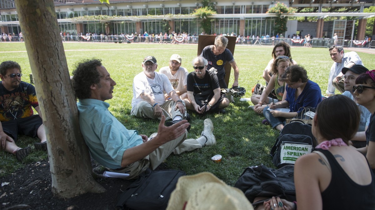 Activists gather in the shade at the Occupy National Gathering in Philadelphia June 30, 2012. (Mannie Garcia/MintPress)